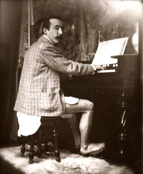 Artist Paul Gaugin plays a harmonium, circa 1895